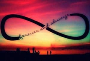 Infinity sign over colourful landscape and small dark images of people. Forever and Always built into the symbol